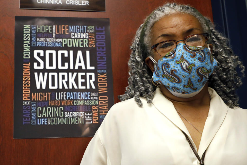 Clinician and social worker Lisa Williams speaks at the Community Health Care Center on the Tougaloo College campus Aug. 14, 2020, in Tougaloo, Miss. Williams said although the coronavirus pandemic has made a lot of the issues that patients deal with worse, they aren't anything new. “People have been struggling for a long, long time," she said. (AP Photo/Rogelio V. Solis)