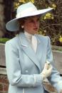 <p>In a pale blue-and-white wide-brim on her way to Easter services. </p>