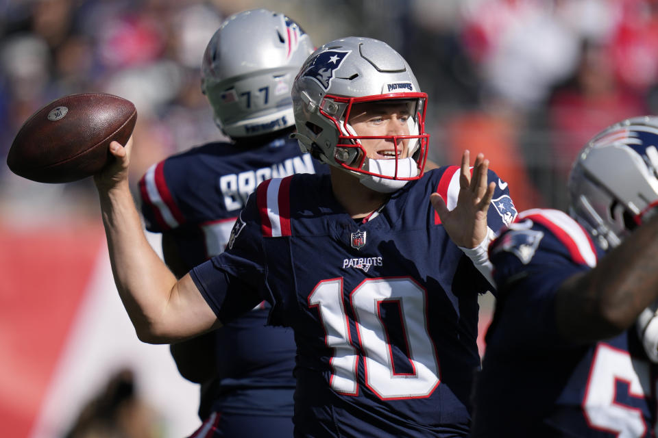 New England Patriots quarterback Mac Jones (10) looks to pass the ball during the first half of an NFL football game against the New Orleans Saints, Sunday, Oct. 8, 2023, in Foxborough, Mass. (AP Photo/Charles Krupa)