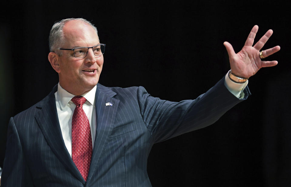 FILE - In this Sept. 19, 2019, file photo, Gov. John Bel Edwards acknowledges his supporters as he comes out onstage for a debate with Eddie Rispone and Republican Rep. Ralph Abraham in Baton Rouge, La. Edwards is battling to hold onto the Democrats’ only governorship in the Deep South. (Bill Feig/The Advocate via AP, Pool, File)