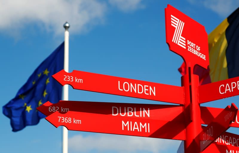 A sign is seen in front of an EU flag at the port of Zeebrugge