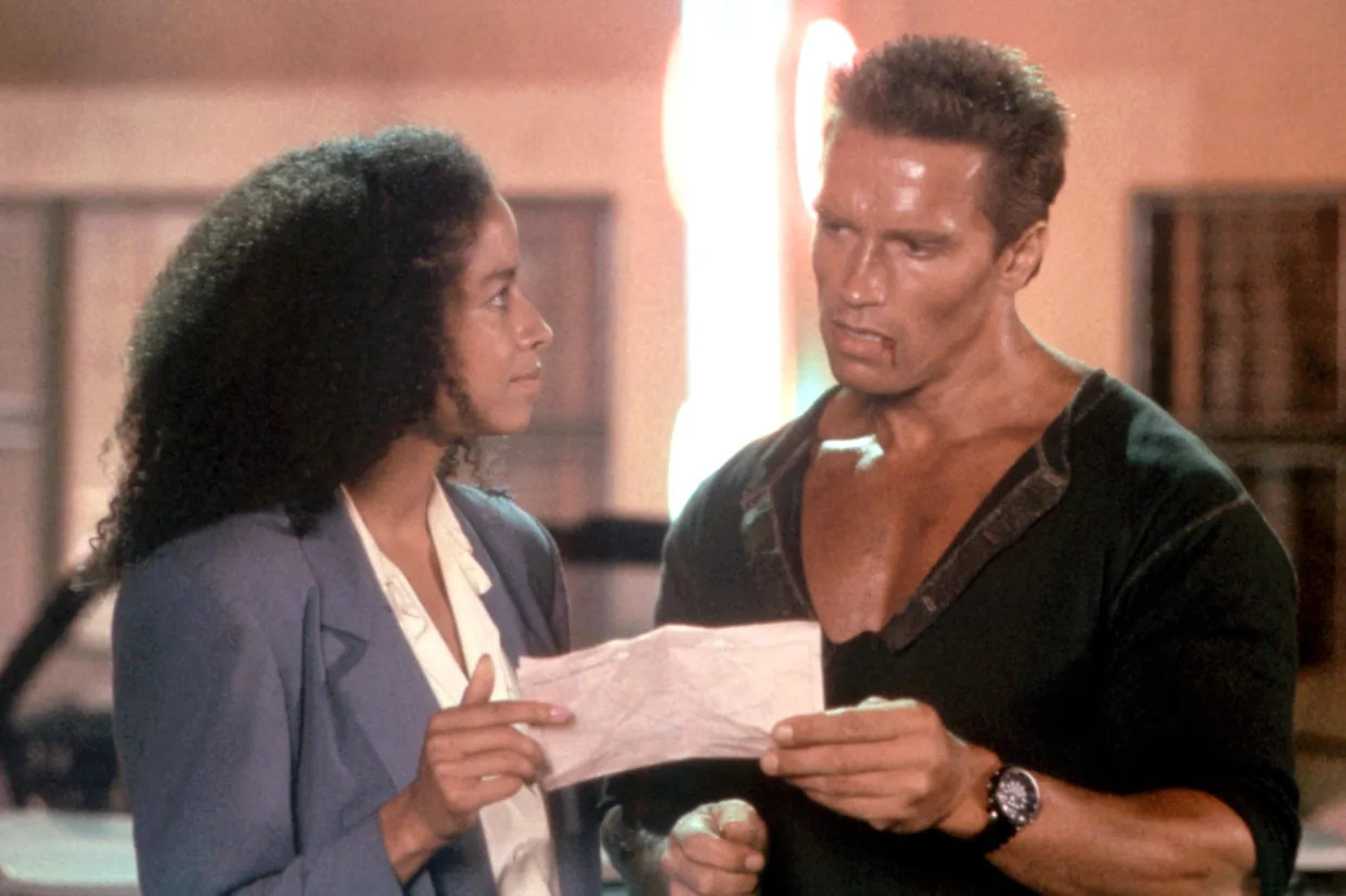 Rae Dawn Chong and Arnold Schwarzenegger had a love scene in an early version of the action favorite 'Commando' (Photo: 20th Century Fox Film Corp.)