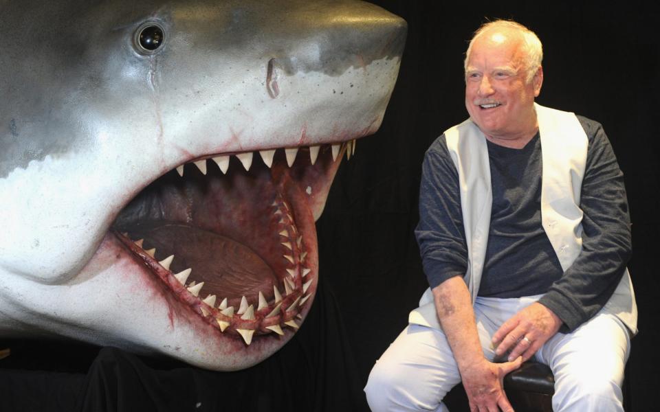 Actor Richard Dreyfuss poses with a model of the shark used in "Jaws" - Credit: Getty