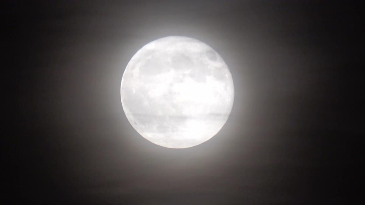 Flower full moon rises over east London