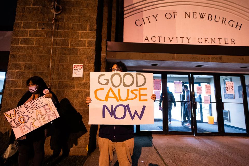 Newburgh residents stand outside the City of Newburgh Acitivity Center holding signs in favor the good cause eviction legislation during the public comment on good cause eviction legislation at a Newburgh City council meeting in Newburgh, NY on Monday, October 25, 2021.