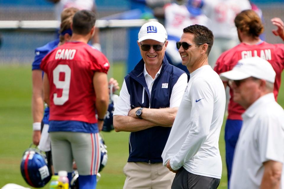 New York Giants general manager Joe Schoen, right, and CEO John Mara talk on the field on day two of mandatory minicamp at the Giants training center on Wednesday, June 14, 2023, in East Rutherford.