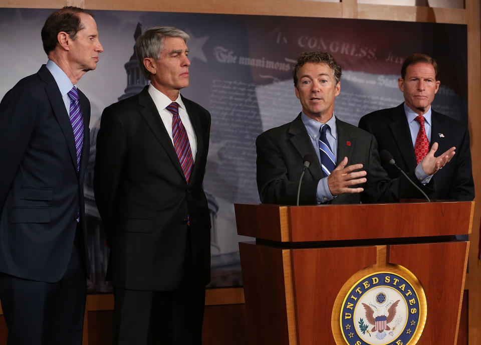 WASHINGTON, DC - SEPTEMBER 25: U.S. Sen. Rand Paul (R-KY) (C) speaks while U.S. Sen. Ron Wyden (D-OR) (L), U.S. Sen. Mark Udall (D-CO) (2ndL) and U.S. Sen. Richard Blumenthal (D-CT) (R), listen during a news conference on Capitol Hill September 25, 2013 in Washington, DC. The bipartisan group of Senators announced new legislation for comprehensive surveillance reform.   (Photo by Mark Wilson/Getty Images)