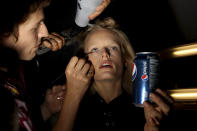 Models are readied backstage before the Diane Von Furstenberg Spring 2013 collection is modeled during Fashion Week in New York, Sunday, Sept. 9, 2012. (AP Photo/Seth Wenig)