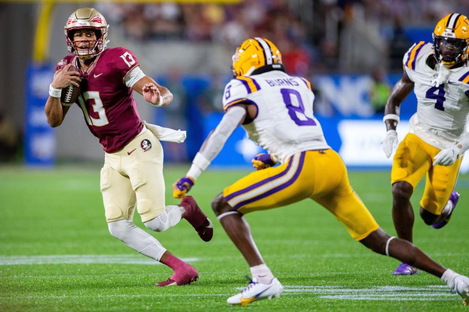 Florida State Seminoles quarterback Jordan Travis (13) looks towards the end zone as he runs the ball on Sunday, Sept. 3, 2023.