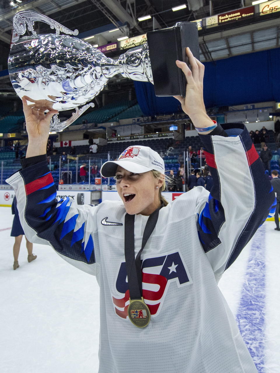 U.S. forward Gigi Marvin holds the trophy following the team's win over Canada during the Four Nations Cup hockey gold-medal game in Saskatoon, Saskatchewan, Saturday, Nov. 10, 2018. (Liam Richards/The Canadian Press via AP)