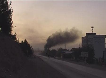 Smoke rises near the U.S. Consulate after an attack by insurgents, in the western Afghanistan city of Herat, in this still image taken from video on September 13, 2013. REUTERS/Reuters TV