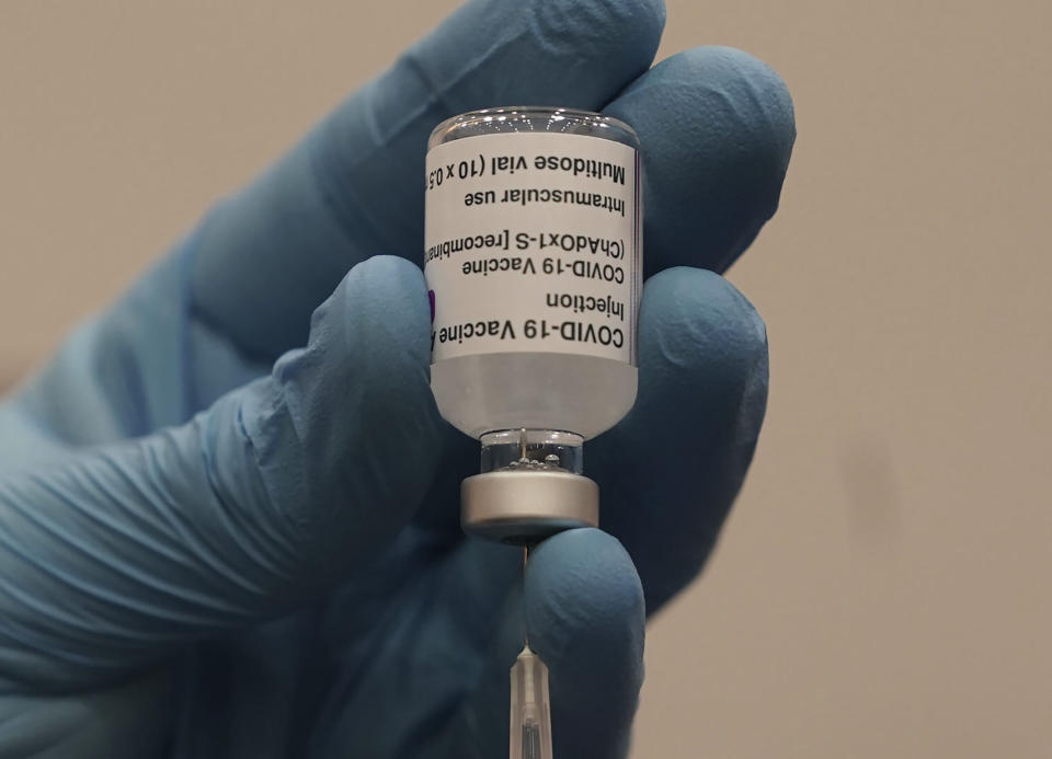 A healthcare worker fills a syringe with the Oxford/AstraZeneca Covid-19 vaccine at the vaccine centre that has been set up in central Newcastle, Scotland Monday Jan. 11, 2021. The centre is one of the seven mass vaccination centres that opened Monday as the government continues to ramp up the coronavirus vaccination programme. (Owen Humphreys/PA via AP)