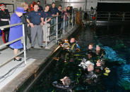 <p>In 2007, the monarch paid a visit to the top-secret set of the James Bond film, chatting with the divers working at the underwater stage at the Pinewood Studios in Iver Heath, England. </p>