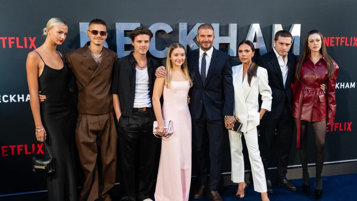 david and victoria beckham and their family posing for a photo at the beckham netflix premiere