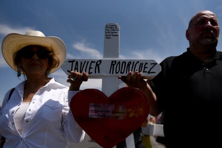 People pay their respects two days after a mass shooting in El Paso