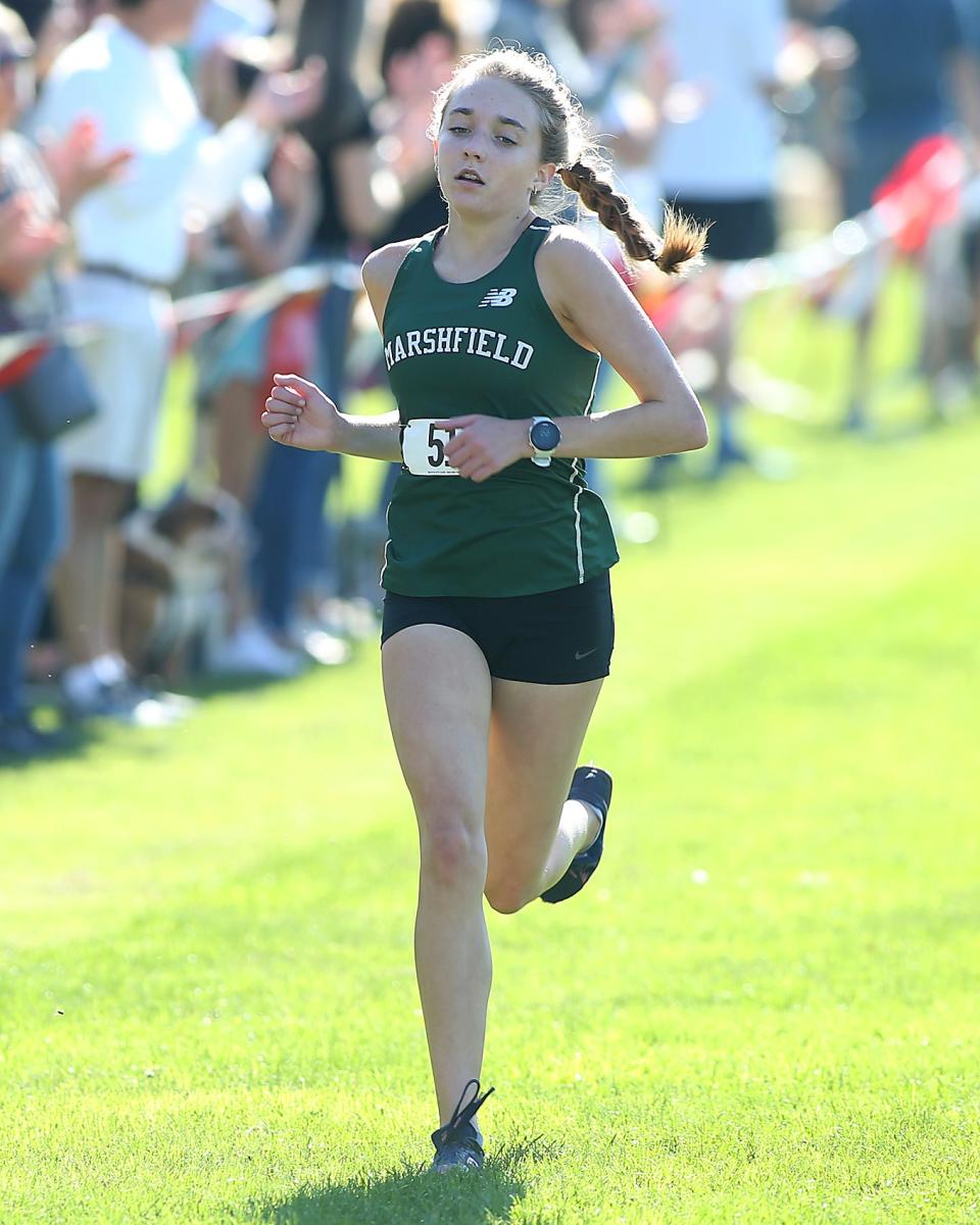 Marshfield’s Charlotte Perreault takes fifth overall with a time of 19:43.59 during the Patriot League Championship Meet at Hingham High School on Saturday, Oct. 28, 2023. Plymouth South boys would win with 48 points while Marshfield girls would win with 24 points.