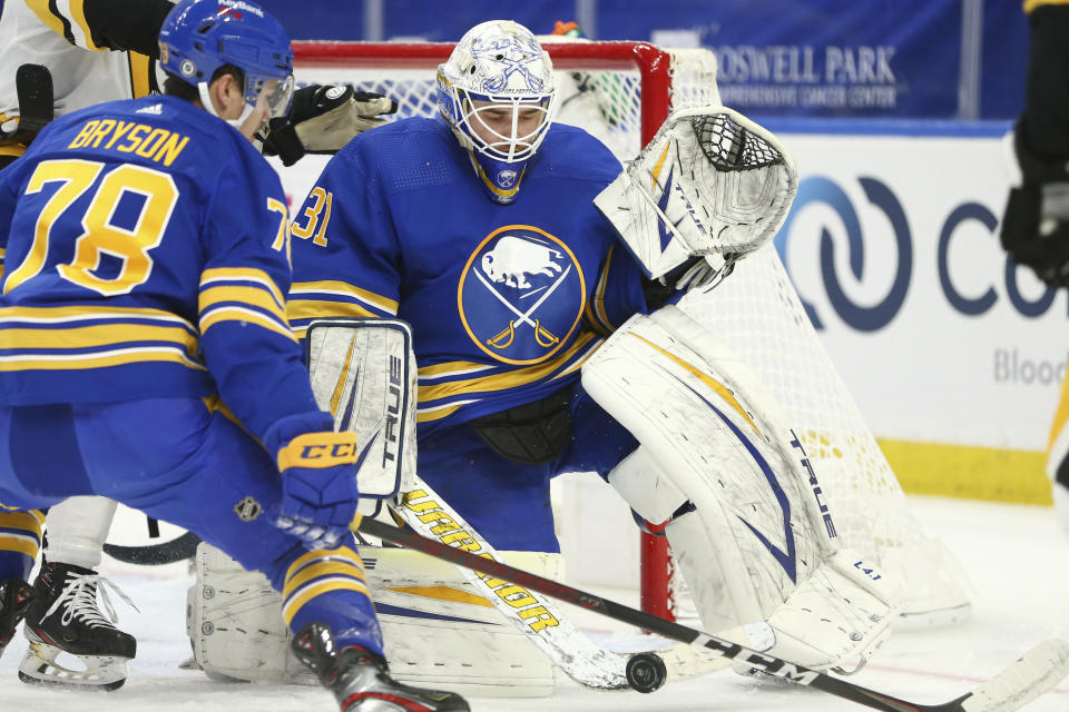 Buffalo Sabres goalie Dustin Tokarski (31) makes a save during the second period of an NHL hockey game against the Pittsburgh Penguins, Saturday, April 17, 2021, in Buffalo, N.Y. (AP Photo/Jeffrey T. Barnes)