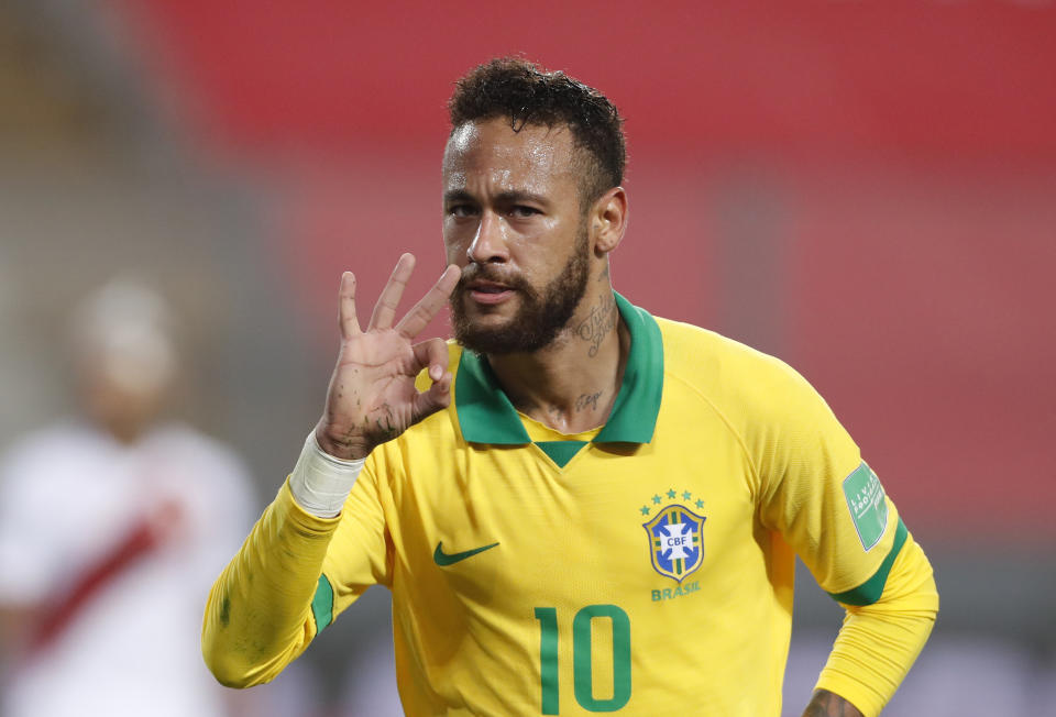 Brazil's Neymar celebrates scoring his third goal against Peru during a qualifying soccer match for the FIFA World Cup Qatar 2022 at the National Stadium, in Lima, Peru, Tuesday, Oct.13, 2020. (Paolo Aguilar, Pool via AP)