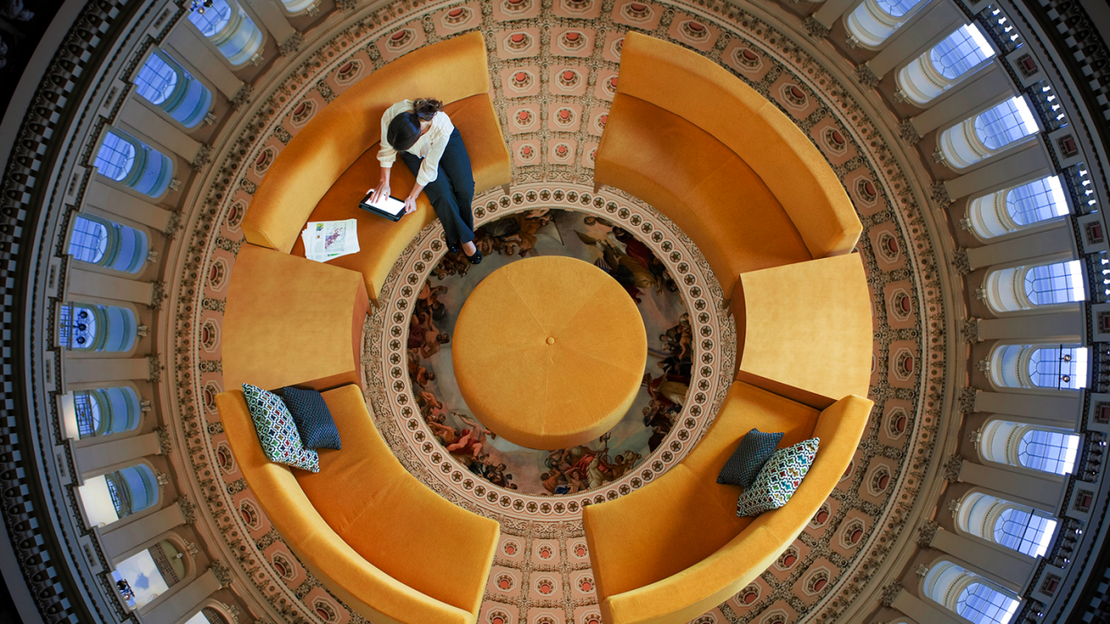 a person standing on a spiral staircase