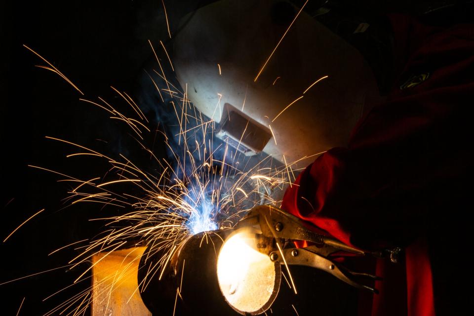 Sparks fly at dual credit Robstown student Evan Ybarra while he welds a 4-inch schedule 80 pipe during a competition at Del Mar College on Friday, Nov. 3, 2023.
