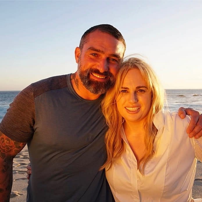 Ant Middleton and Rebel Wilson posing on a beach