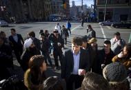Leader of the Liberal Party of Canada MP Justin Trudeau walks across Hastings Street in the downtown eastside neighbourhood in Vancouver, British Columbia December 18, 2013. REUTERS/Ben Nelms (CANADA - Tags: POLITICS)