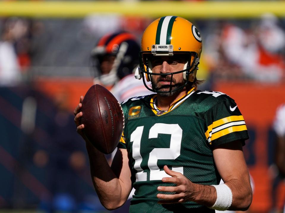 Aaron Rodgers warms up ahead of a game against the Chicago Bears.