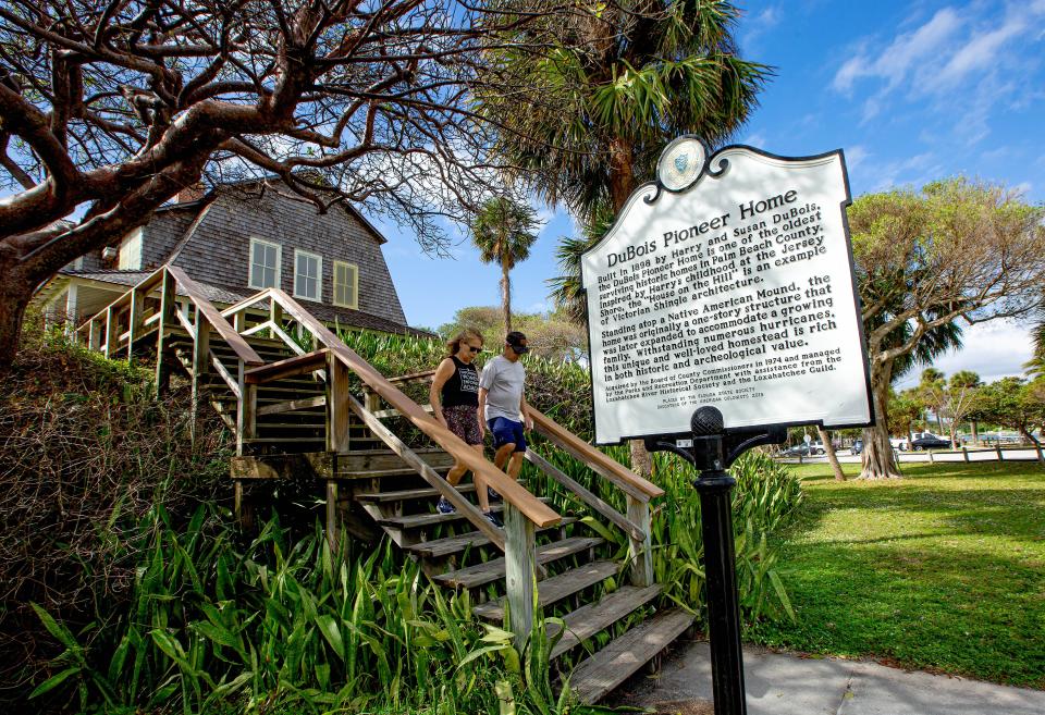 Visitors walk by a sign in front of the DuBois Pioneer Home on Saturday, Nov. 25, 2023, in Jupiter. The home is open to tours on a limited basis.