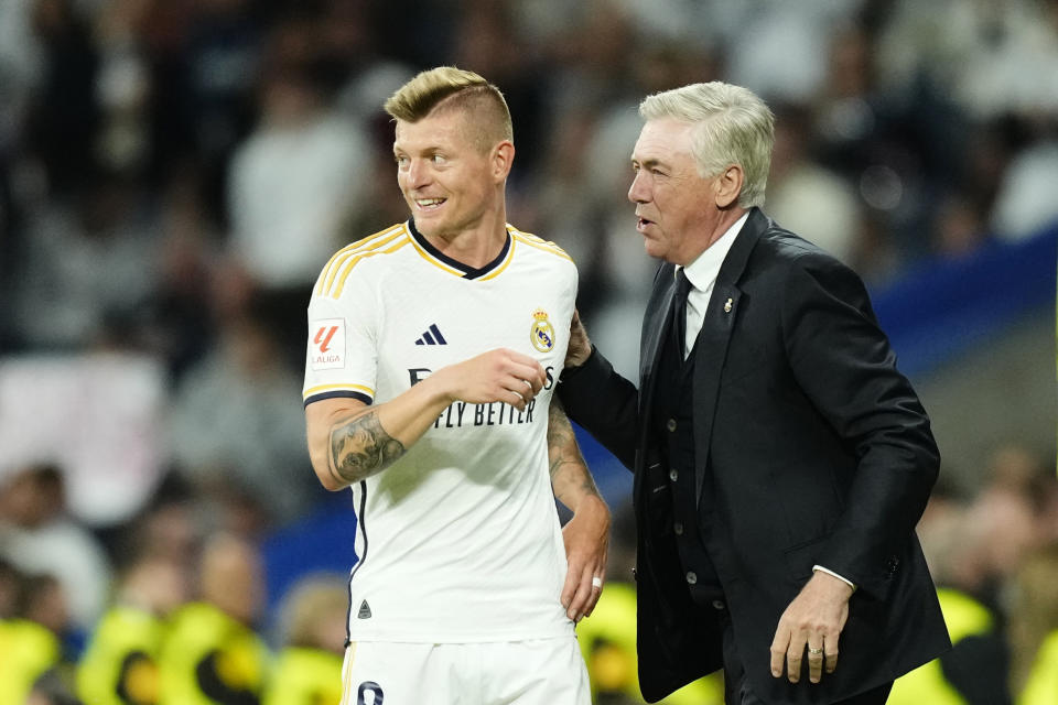 Real Madrid's head coach Carlo Ancelotti, right, and Real Madrid's Toni Kroos during the Spanish La Liga soccer match between Real Madrid and Deportivo Alaves at the Santiago Bernabeu stadium in Madrid, Spain, Tuesday, May 14, 2024. (AP Photo/Jose Breton)