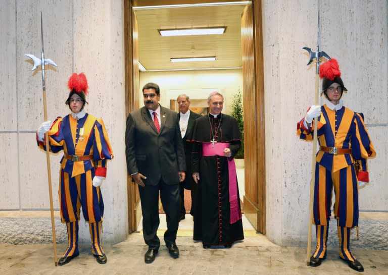 Embattled Venezuelan President Nicolas Maduro (2-L) heads for a meeting with Pope Francis at the Vatican on October 24, 2016