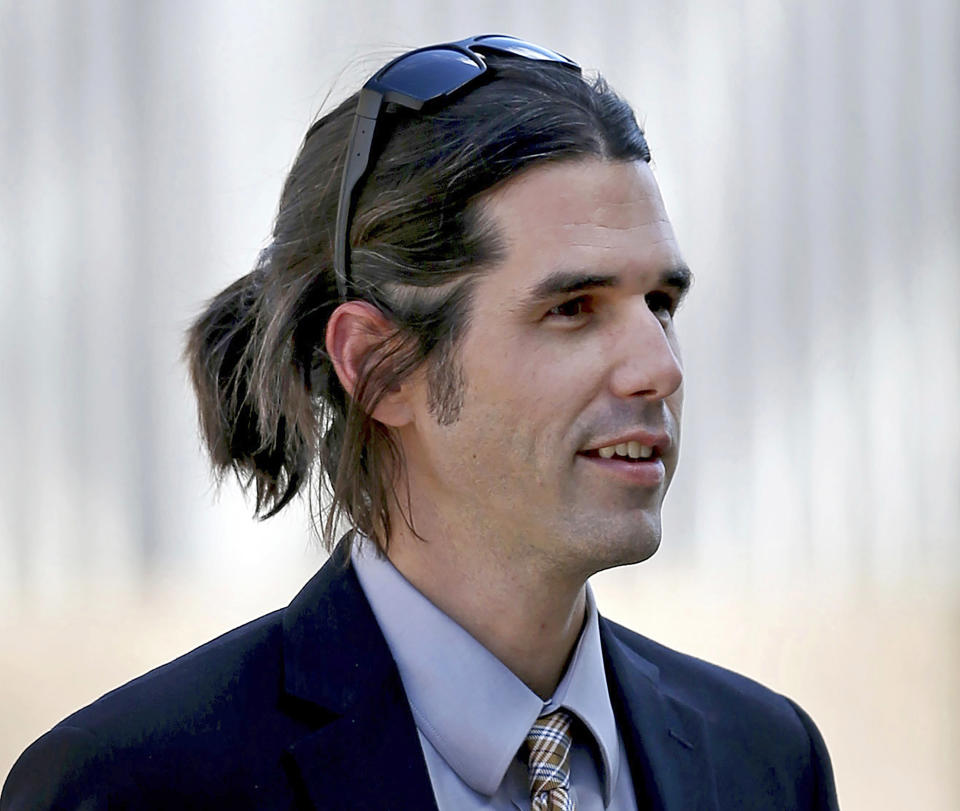 FILE - In this 2018 file photo border activist Scott Warren, who is charged with immigrant harboring, walks into federal court in Tucson, Ariz. Closing arguments were scheduled Wednesday, Nov. 20, 2019, at Warren's trial. Prosecutors say Warren, a member of a group that tries to prevent immigrant deaths in the desert, tried to hide two Central American immigrants at a camp in southern Arizona. Warren has denied helping hide immigrants. (Kelly Presnell/Arizona Daily Star via AP, File)