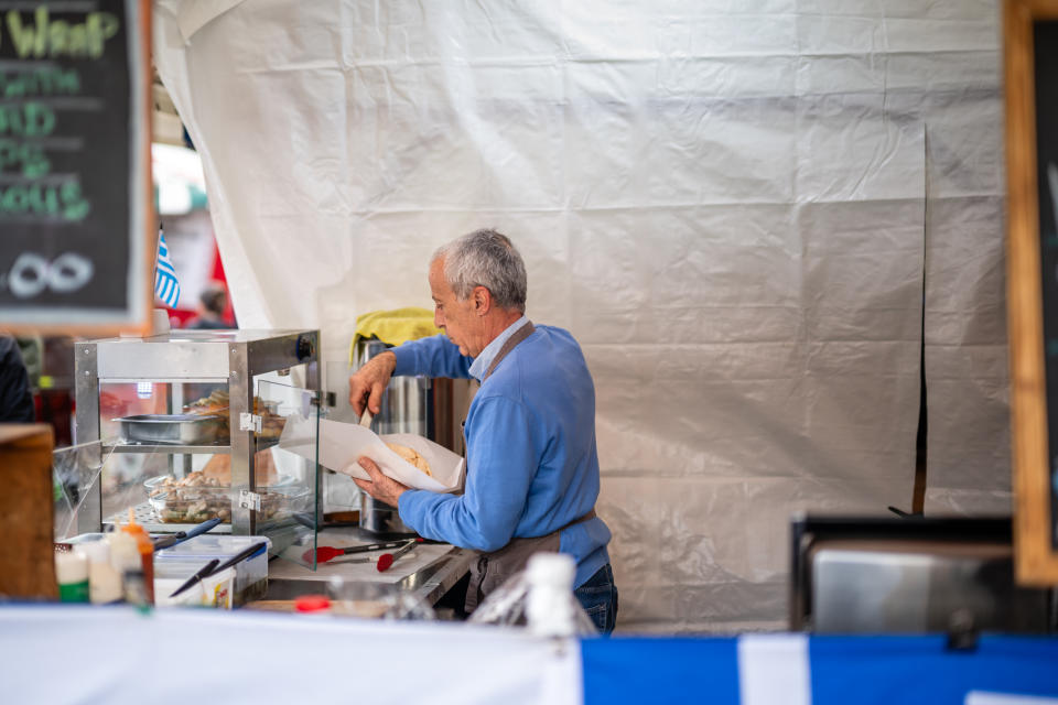 Photo of a food seller at a market taken with the Nikon Z f