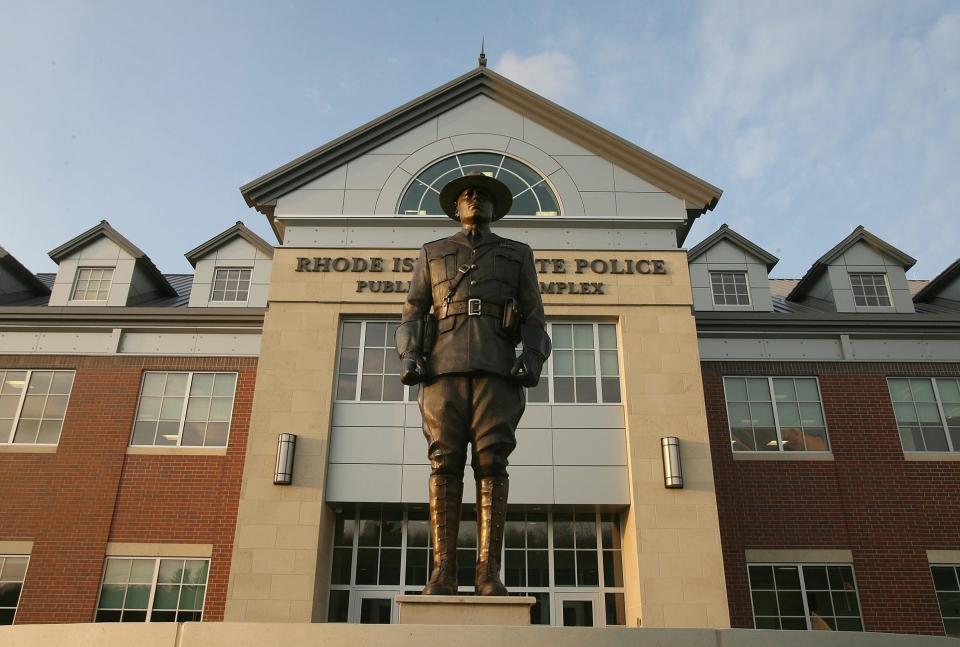 A statue of a Rhode Island State Police trooper stands in front of the current headquarters in Scituate.