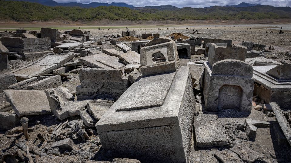 Tombstones are among the relics uncovered in the dried up dam. - Ezra Acayan/Getty Images