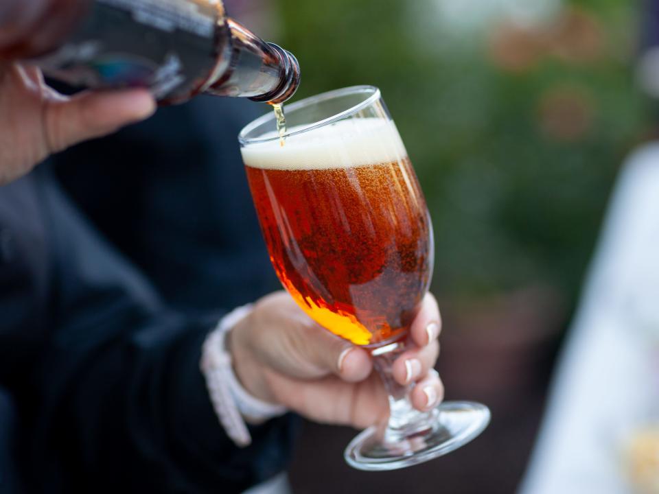 Man pours beer