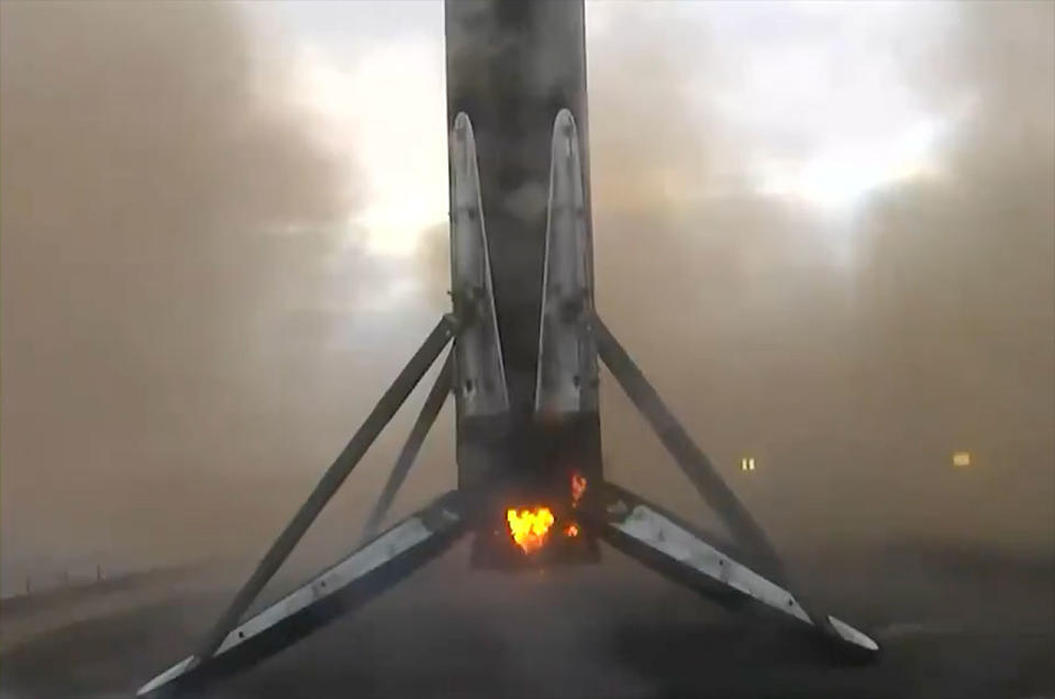 A SpaceX Falcon 9 rocket's first stage is seen after landing on the droneship Of Course I Still Love You off the coast of California on Tuesday, Jan. 23, 2024.