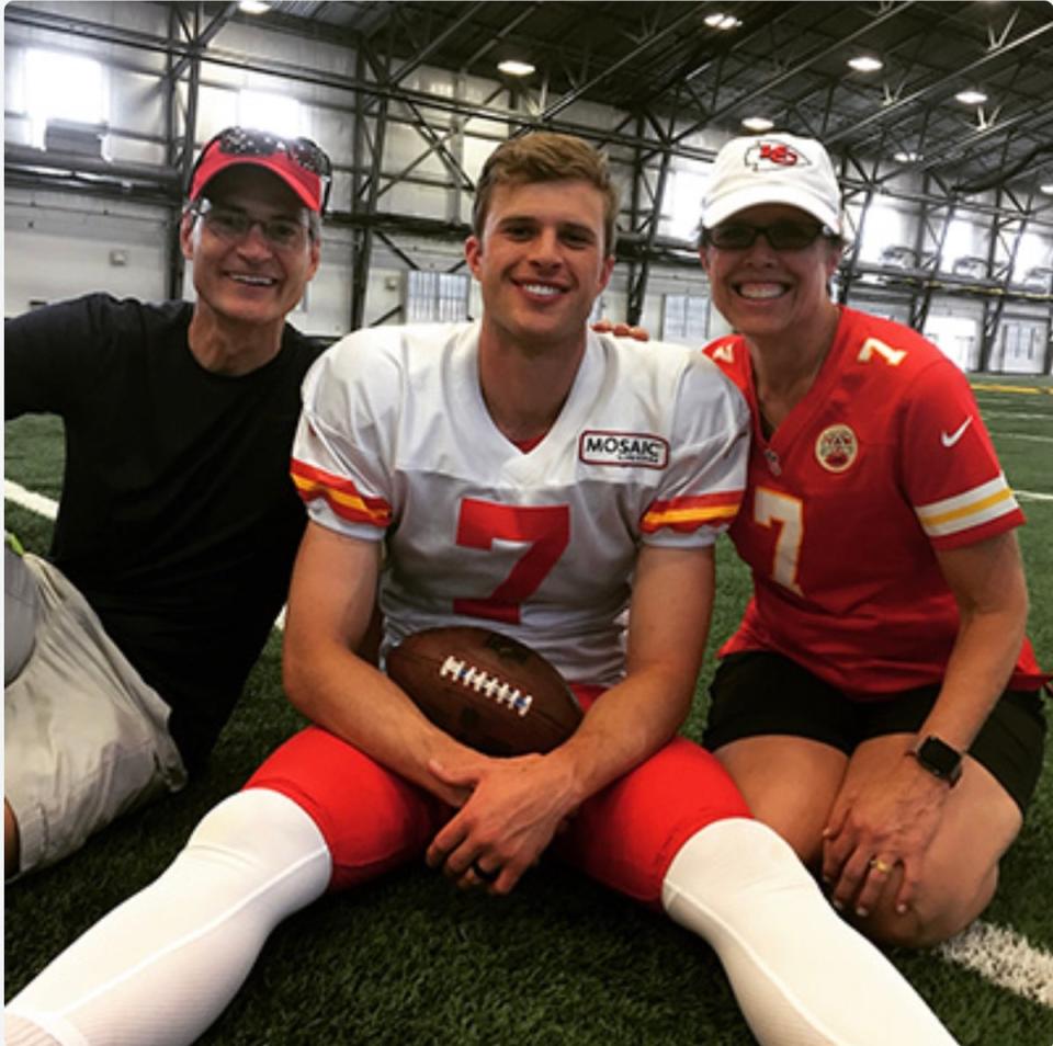 Harrison Butker with his parents Harrison and Elizabeth Butker. Ms Butker is a physicist at Emory University (Supplied)