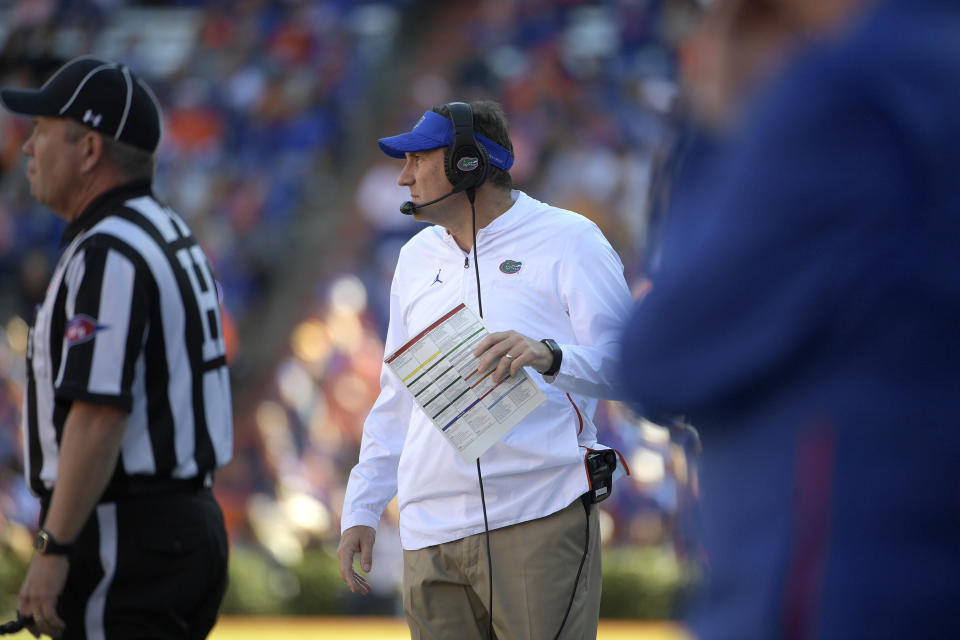 Florida head coach Dan Mullen, center, watches from the sideline during the first half of an NCAA college football game against Missouri Saturday, Nov. 3, 2018, in Gainesville, Fla. (AP Photo/Phelan M. Ebenhack)