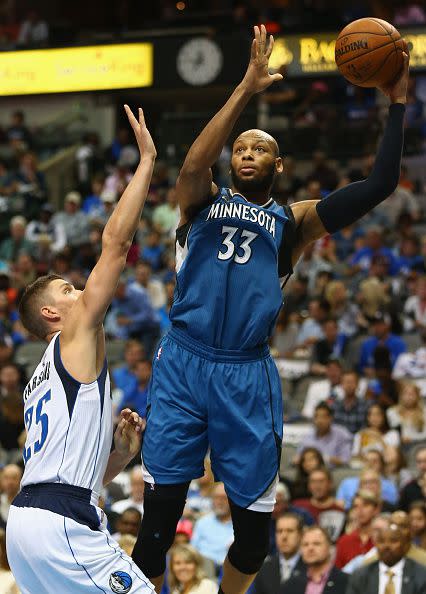 Adreian Payne #33 of the Minnesota Timberwolves takes a shot against Chandler Parsons #25 of the Dallas Mavericks at American Airlines Center on February 28, 2016 in Dallas, Texas. (Photo by Ronald Martinez/Getty Images)