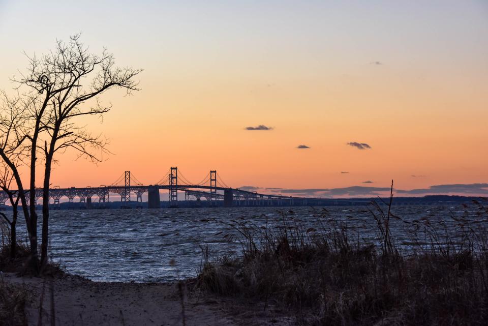 The sun sets over the Chesapeake Bay Bridge in Terrapin Nature Park on Thursday, Jan 10, 2019.