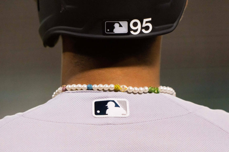 Despite the Yankees' infamous dress code, Oswaldo Cabrera dons a Pollyanna necklace for every game. (Stan Szeto-USA TODAY Sports)