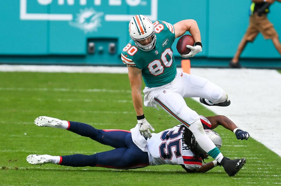 Miami Dolphins tight end Adam Shaheen (80) avoids a tackle in December at Hard Rock Stadium.