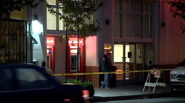 Police survey the scene where an alleged bank robber fell through a roof into an apartment while attempting to flee police. Photo: CBS