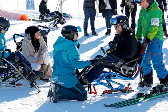 <p>Andrew Chin/Getty</p> Prince Harry sits in an adaptive ski on February 14, 2024