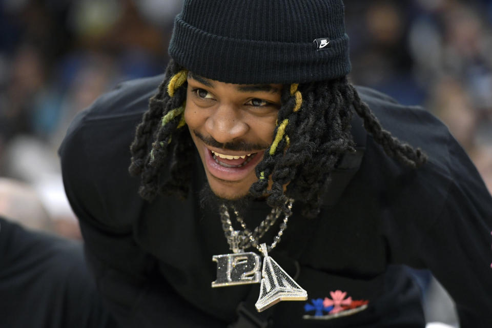 Memphis Grizzlies guard Ja Morant reacts from the bench in the first half of an NBA basketball game against the Orlando Magic, Friday, Jan. 26, 2024, in Memphis, Tenn. (AP Photo/Brandon Dill)