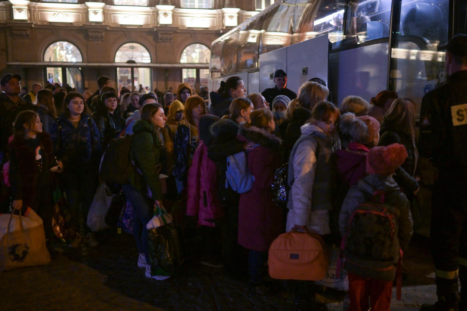 PREZEMYSL, POLAND - MARCH 23: People, mainly women and children, board coaches at Przemysl station as they continue their onward journey from war-torn Ukraine on March 23, 2022 in Przemysl, Poland. Nearly two-thirds of the more than 3 million people to have fled Ukraine since Russia's invasion last month have come to Poland, which shares a 310-mile border with its eastern neighbor. (Photo by Jeff J Mitchell/Getty Images)