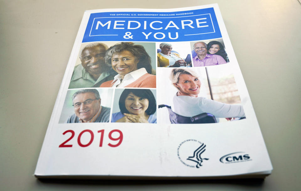 FILE - In this Nov. 8, 2018 file photo, the U.S. Medicare Handbook is photographed in Washington. Medicare’s new prescription drug plan finder has a glitch that can steer unwitting seniors to coverage that costs much more than they need to pay. (AP Photo/Pablo Martinez Monsivais)