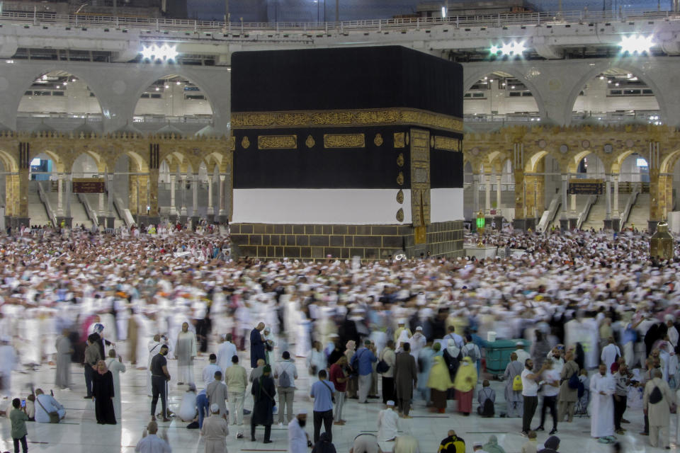 Muslim pilgrims circumambulate around the Kaaba, the cubic structure at the Grand Mosque, during the annual hajj pilgrimage, in Mecca, Saudi Arabia, Saturday, June 24, 2023. Muslim pilgrims are converging on Saudi Arabia's holy city of Mecca for the largest hajj since the coronavirus pandemic severely curtailed access to one of Islam's five pillars. (AP Photo/Amr Nabil)