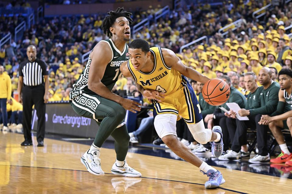 Nimari Burnett of the Michigan Wolverines dribbles against the Michigan State Spartans in the first half at Crisler Center in Ann Arbor on Saturday, Feb. 17, 2024.