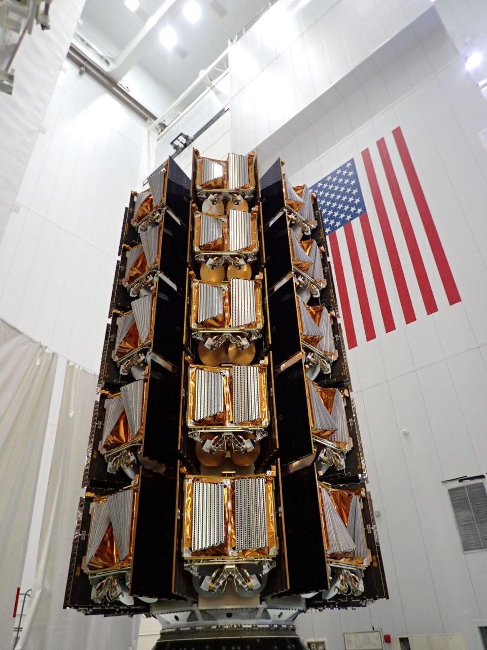 A stack of 40 OneWeb internet-beaming satellites is seen here prior to encapsulation inside the protective nosecone payload fairing of a SpaceX Falcon 9. Once deployed, the fleet will complete 80% of OneWeb's first-generation constellation of 648 satellites in low Earth orbit to deliver global wholesale connectivity for its partners.